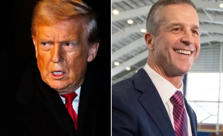 John Harbaugh shaking hands with John Mara during his introduction as the New York Giants head coach.